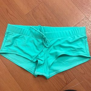 Mint Body Glove brand boy short swimsuit bottoms.